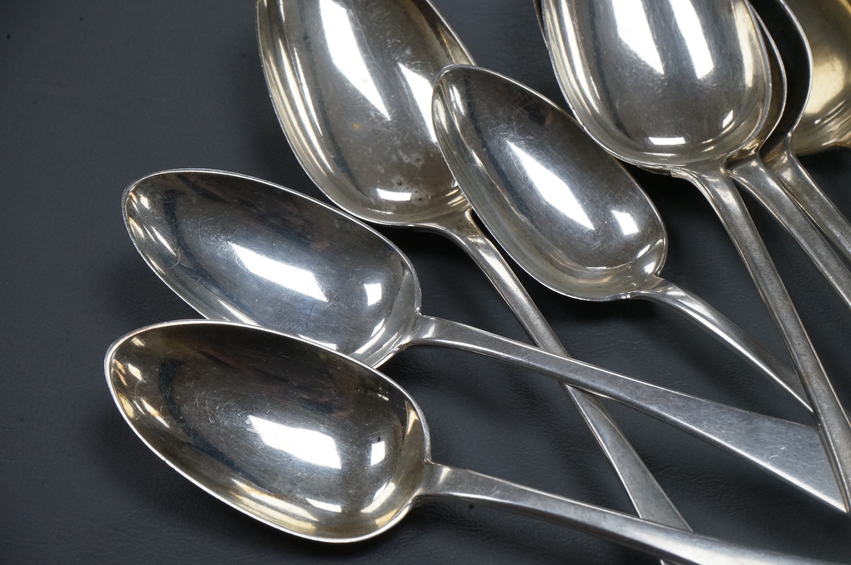 A set of six early Victorian silver Old English pattern table spoons, by William Bateman, London, 1837, 22.5cm, together with a set of eight provincial silver Old English pattern dessert spoons, Thomas Wheatley, Newcastl